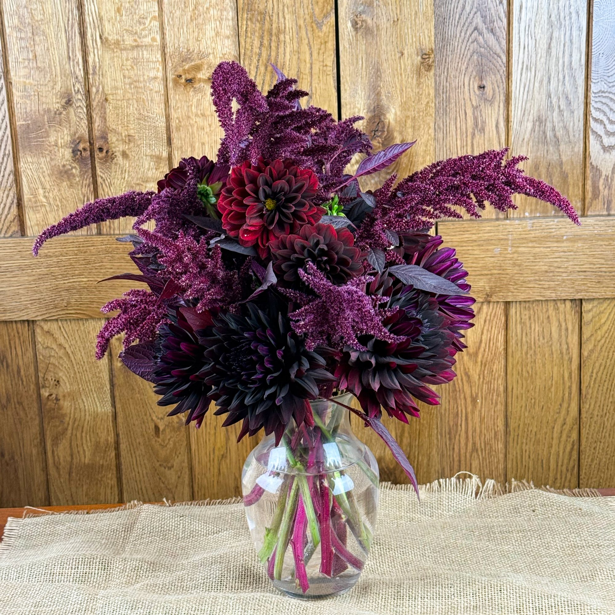 A red market bouquet containing dahlia and amaranthus..